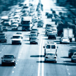 Highway with lots of cars. Blue tint, high contrast and motion blur to rise speed.