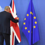 A member of protocol adjusts the British flag prior to the arrival of British Prime Minister David Cameron at EU headquarters in Brussels on Tuesday, June 28, 2016. EU heads of state and government meet Tuesday and Wednesday in Brussels for the first time since Britain voted to leave the European Union, throwing British and European politics into disarray. (AP Photo/Geert Vanden Wijngaert)