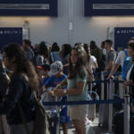 Delta passengers make their way through Terminal C at LaGuardia Airport in Queens, New York, Thursday August 8, 2016. Due to a computer malfunction, Delta's global operations were grounded on Monday morning, with delayed flights resuming around 8:30 AM. Photograph: Victor J. Blue