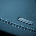 Luxury car interior details. Airbag badge on dashboard