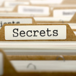 Secrets Concept. Word on Folder Register of Card Index. Selective Focus.