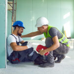Construction worker accident with a construction worker. First aid for injury at work.