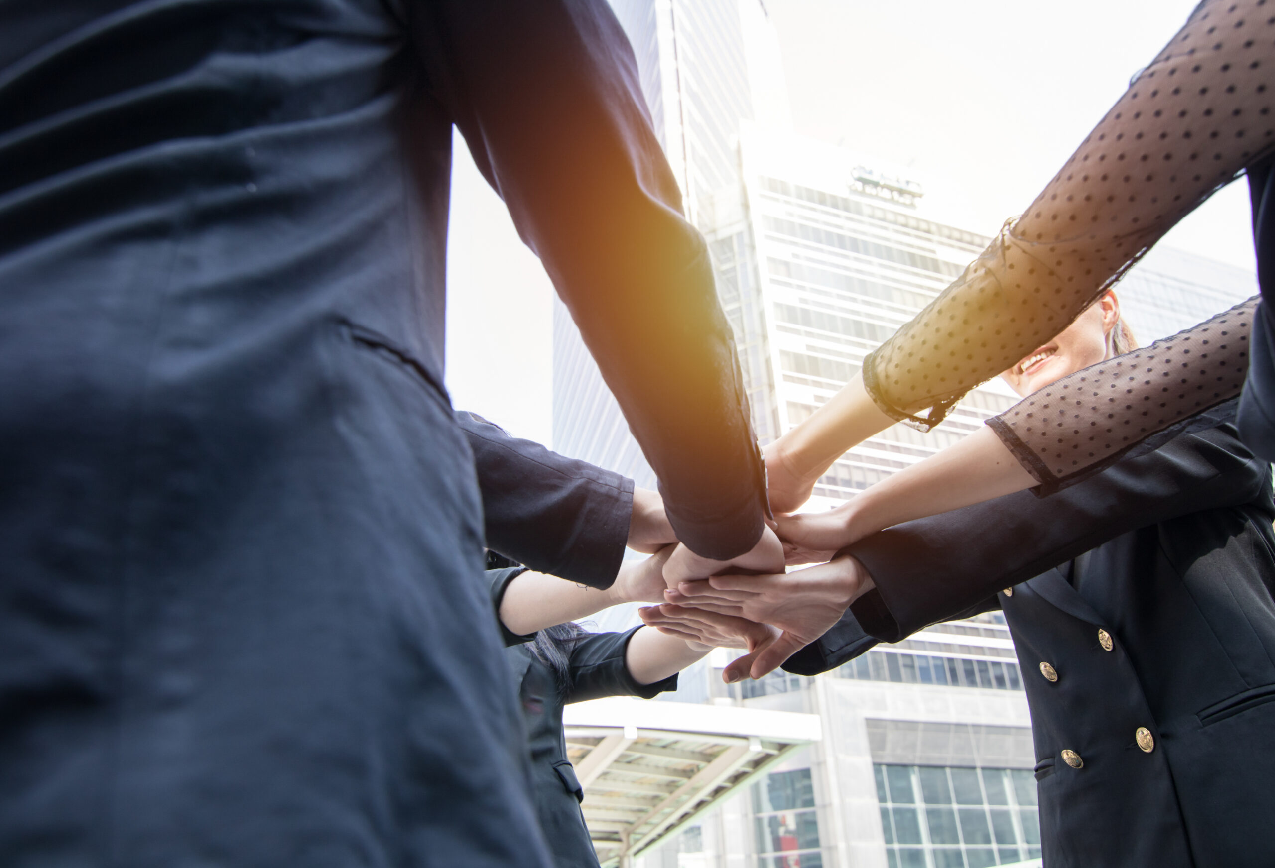 Join forces and succesful team concept, businessman joining hand together