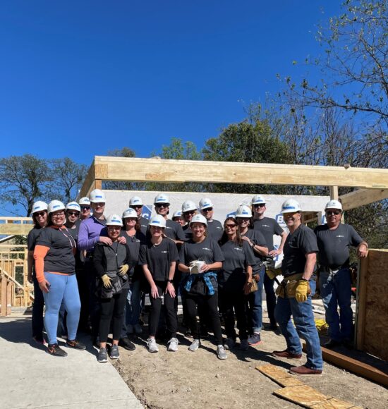 Arlington colleagues volunteering during a Habitat for Humanity day.