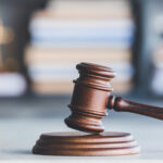 Judge's gavel on table in office