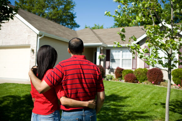 Home-Owners Admiring their Home