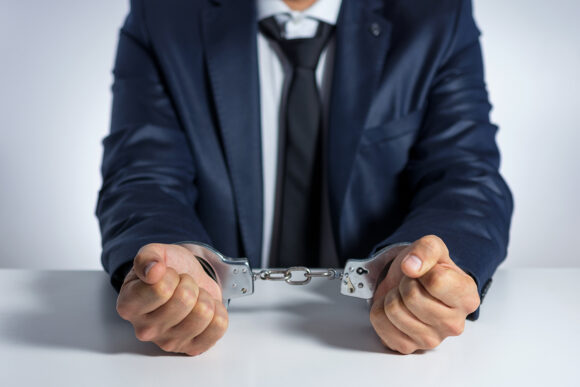 Businessman with handcuffs