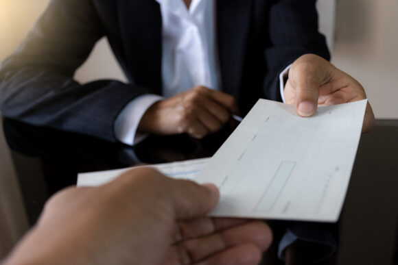 Business woman or manager in suit hand holding pen