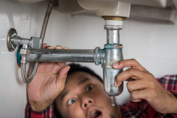 Repairing clogged and leaky washbasin sewer in the bathroom