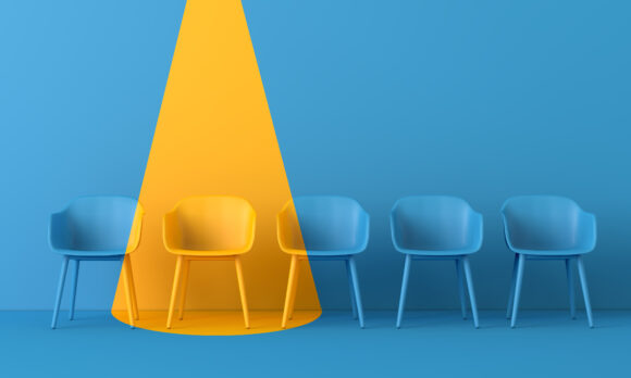 Yellow chair standing out from the crowd. Business concept. 3D rendering