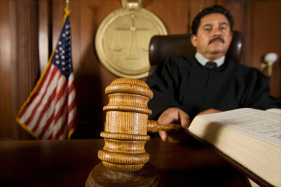 Judge using gavel in court