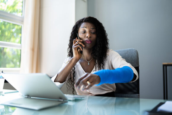 Broken Arm Injured Worker Compensation Coverage. Using Office Laptop