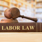Labor Law books with a judges gavel on desk in the library. Law education ,law books concept.