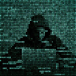 Hacker in data security concept. Hacker using laptop. Hacking the Internet. Cyber attack.