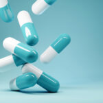 A group of antibiotic pill capsules fallling. Healthcare and medical 3D illustration background.