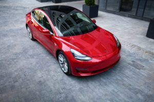 Kyiv, Ukraine - June 7, 2020: Red Tesla car in residential area