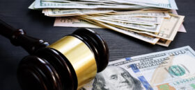 Bail bond and financial penalty. Gavel and money.