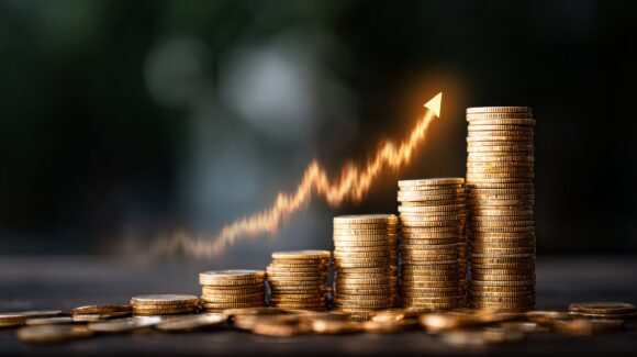 Rising financial growth arrow on stacked coins with digital profit graph, investment strategy concept showing business success, economic market development, earnings increase, and futuristic finance b