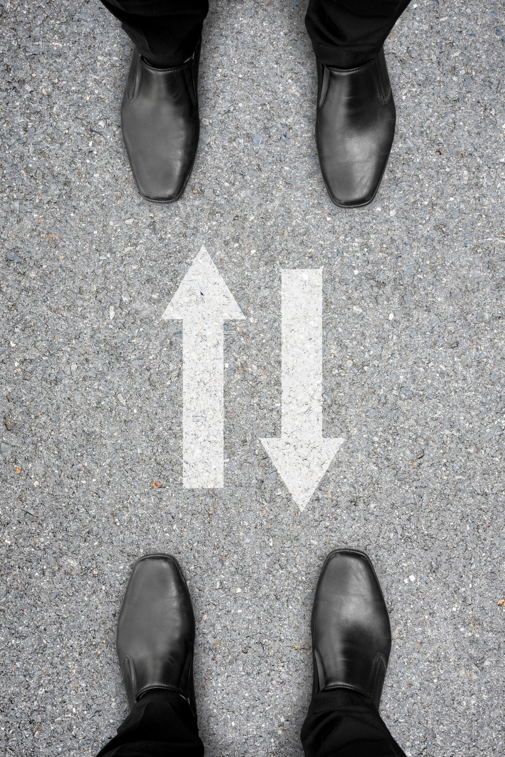 Two men standing in front of each other and two way drive sign between them. Represent two way communication in business to make success.