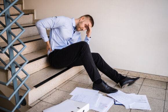 Fall And Fall Injury Accident At Workplace. Man Fell Down Stairs