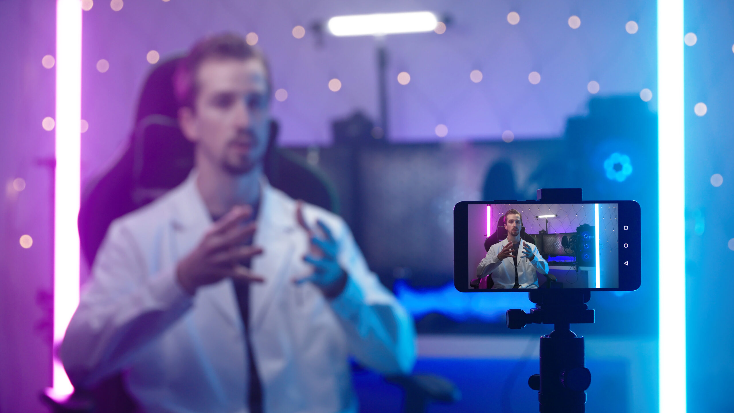 Futuristic doctor influencer recording video on smartphone