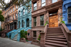 a view of a row of historic brownstones in an iconic neighborhoo