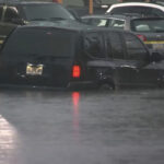 This image made from video shows cars submerged in floodwaters in Rahway, NJ., on July 14, 2025.(WABC-TV via AP)