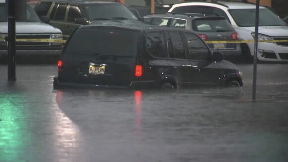 This image made from video shows cars submerged in floodwaters in Rahway, NJ., on July 14, 2025.(WABC-TV via AP)