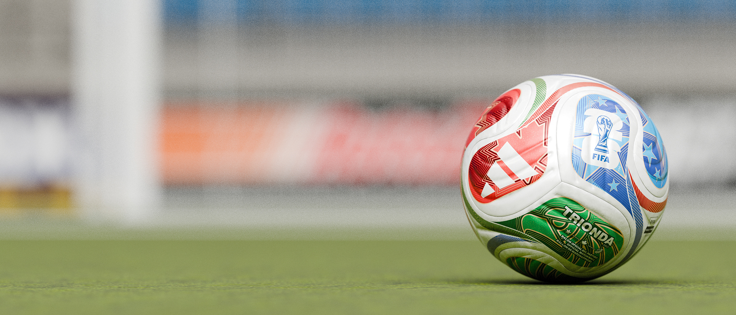 Minimal scene of FIFA World Cup 2026 ball on grass, soft stadium
