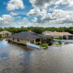 Hurricane Debby tropical rainstorm flooded residential homes in suburban community in Sarasota, Florida. Aftermath of natural disaster.