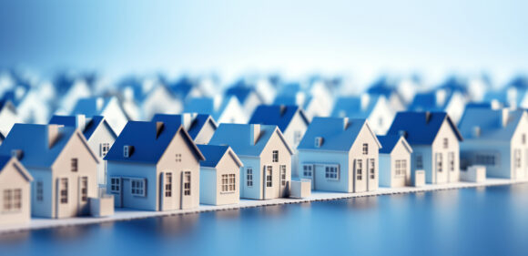 A small model of houses in blue and white colors.