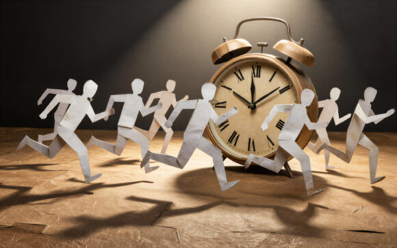 Paper cutouts race past a vintage alarm clock symbolizing urgency