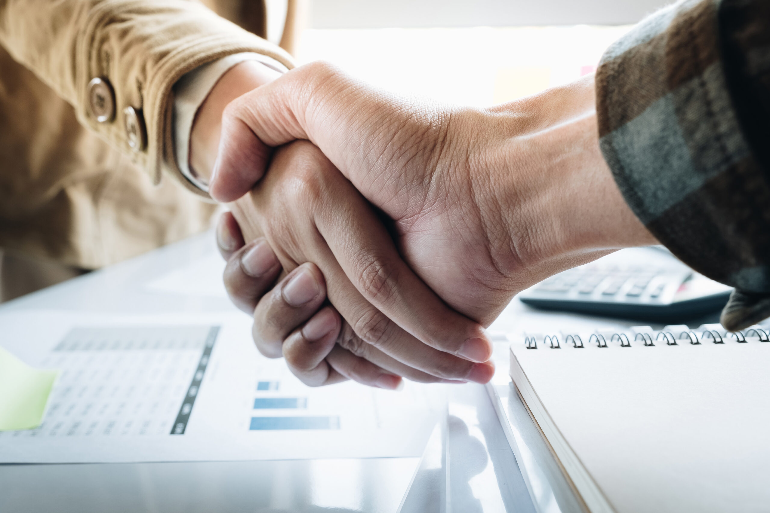 Close up of Business people shaking hands, finishing up meeting, business etiquette, congratulation, merger and acquisition concept