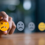 Businessman pressing unhappy customer feedback icon on digital ratings