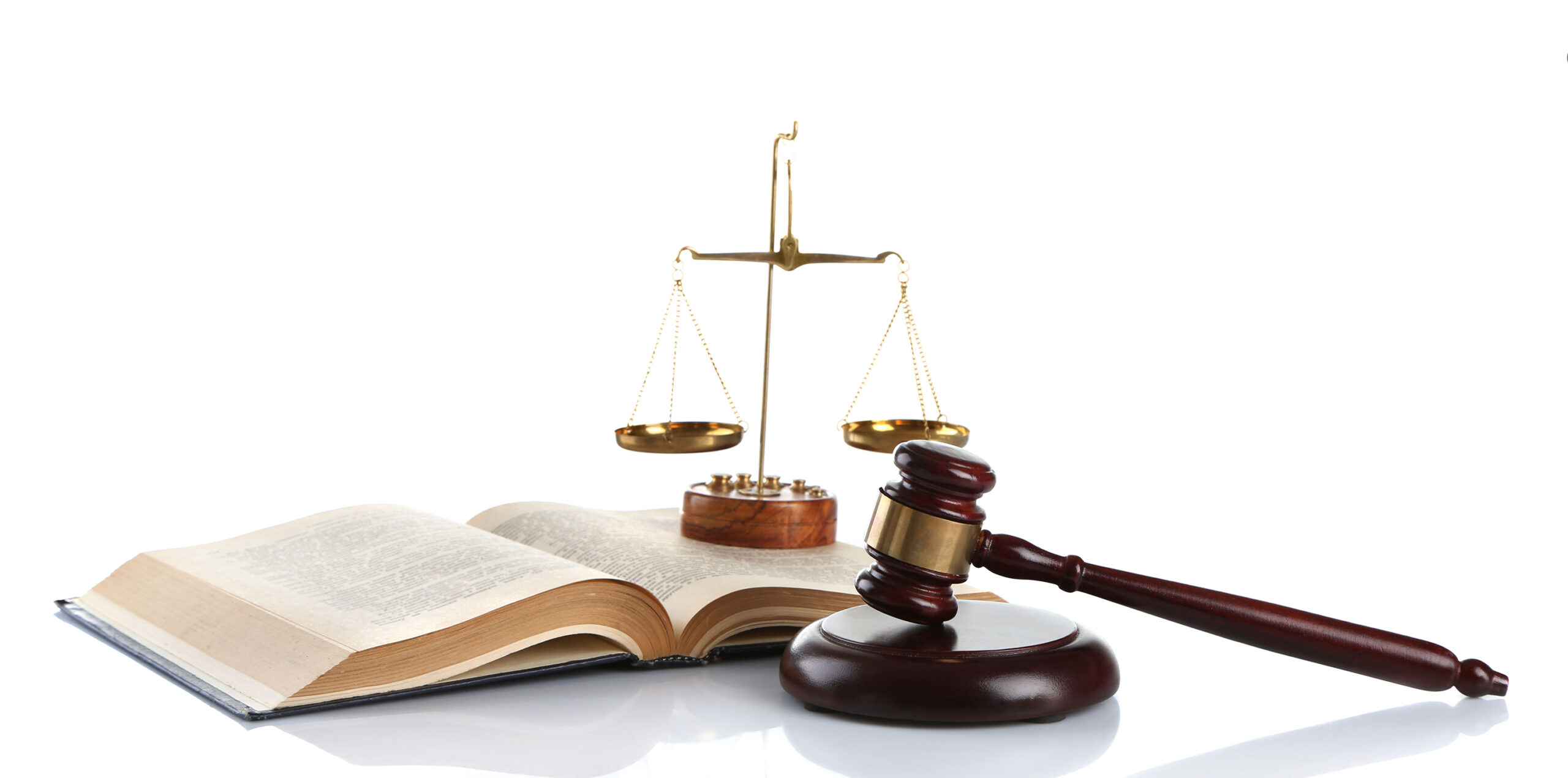 Wooden gavel with justice scales and open book, isolated on white background