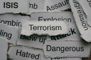 Torn paper pieces with words including terrorism, explosion and dangerous