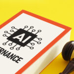 A book labeled "AI Governance" next to a judge's gavel