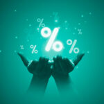 Two hand holding percentage symbol for financial banking increase interest rate or mortgage investment dividend from business growth concept.