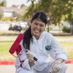 B&B associate Gabrielle Tan-Torrez freshens up fire lanes with a coat of paint.