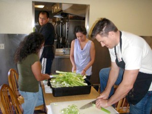 Abram Interstate Insurance employees prepare food for Loaves and Fishes