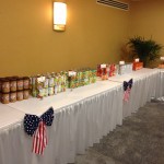 The Nautilus Insurance Co. booth at AAMGA's 2013 annual meeting, where members were able to put together care packages that were sent to the troops.