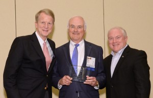 L-R: Bobby Reagan, chairman of Reagan Consulting, MHBT CEO Bill Henry and Tom Minkler, president of IIABA.