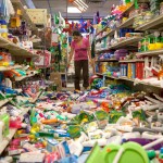 Winemaker Tom Montgomery walks through wine to see the damage following an earthquake at the B.R. Cohn Winery barrel storage facility Sunday in Napa, Calif. (AP Photo/Eric Risberg)