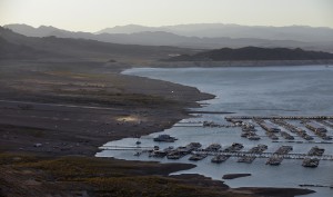 Wind kicks up dust on an area that was once under water at Hemenway Harbor in the Lake Mead National Recreation Area in Nevada. As the lake levels drop the floating marinas move to adjust to the changing shoreline. (AP Photo/John Locher)